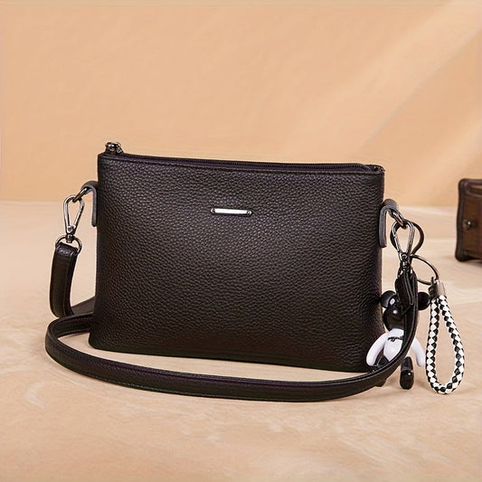 El elegante bolso bandolera de piel minimalista de Elena