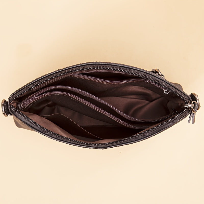 El elegante bolso bandolera de piel minimalista de Elena