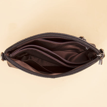 El elegante bolso bandolera de piel minimalista de Elena