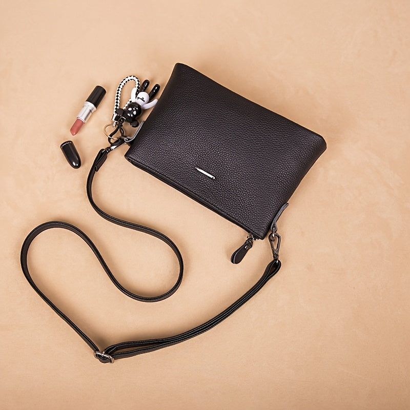 El elegante bolso bandolera de piel minimalista de Elena