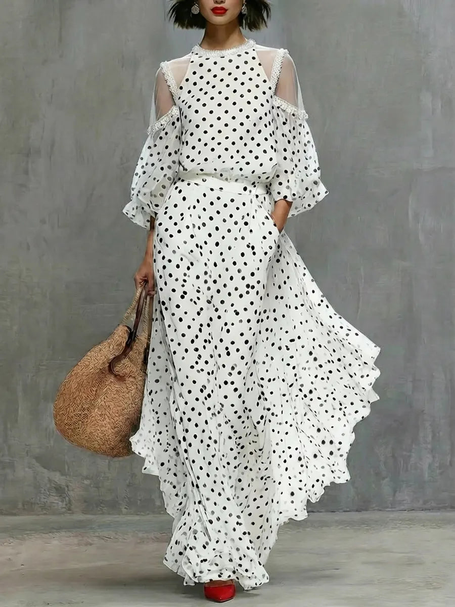 Valeria | Vestido largo fluido con estampado de lunares y hombros abiertos