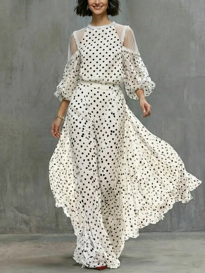 Valeria | Vestido largo fluido con estampado de lunares y hombros abiertos